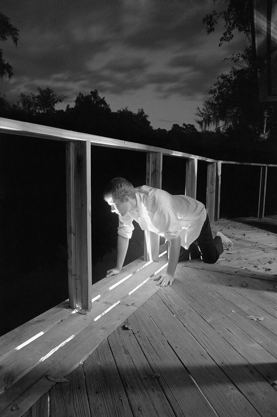 Man kneeling on deck